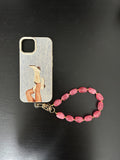 Beaded Phone Charm in perzik met goudkleurige accenten